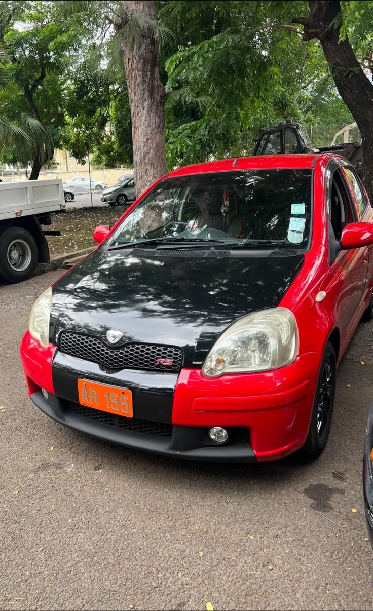 Front view of a red IQ Driving School training car