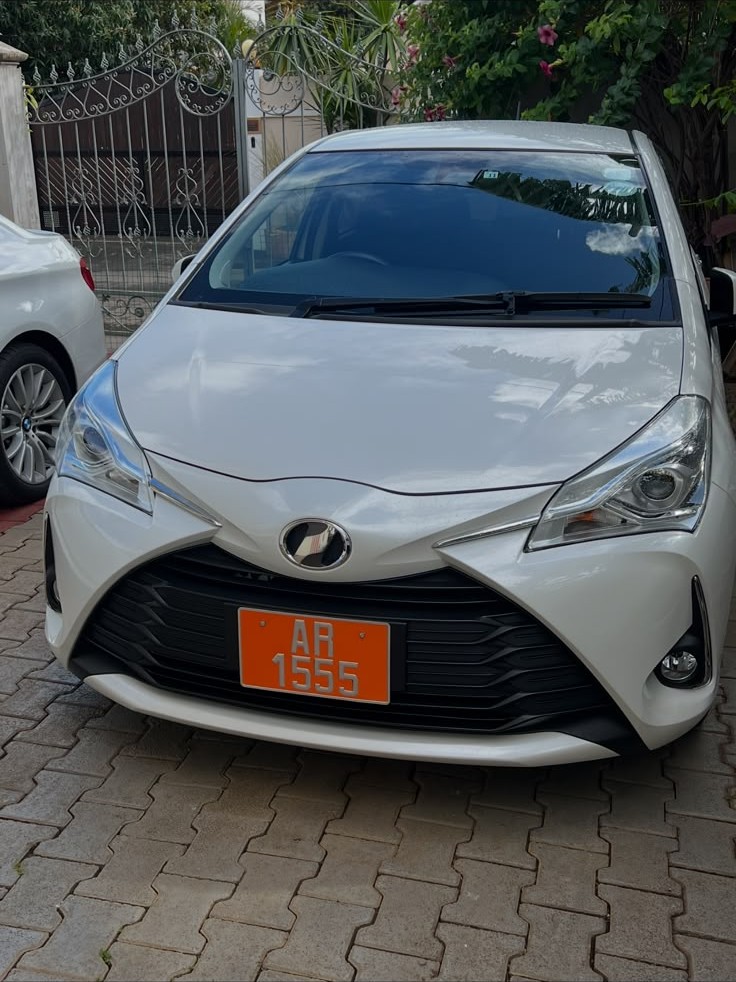 White IQ Driving School training car photographed during the day